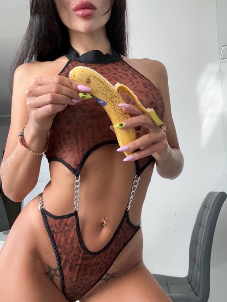 Glamorous OnlyFans chick Kris Top poses in her hot lingerie & eats a banana
