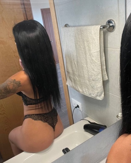 Provocative amateur posing in her black bikini and lingerie in a solo